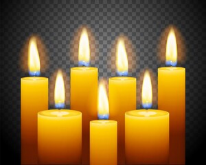 Set of three burning candles on dark background