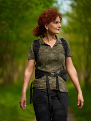 Active woman with backpack hiking