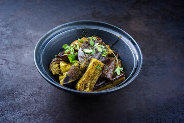 Traditional Indian eggplant curry fry served as side dish in a design bowl