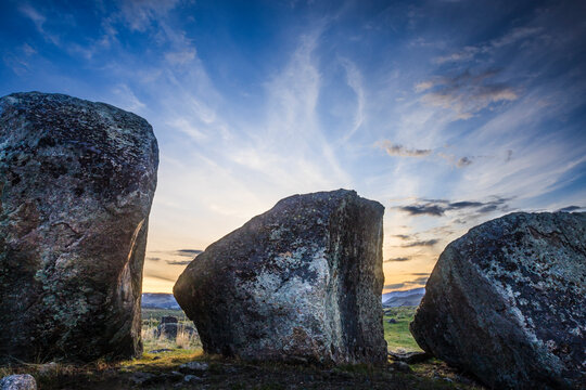 Basalt boulders are set against the setting sun in the Lamar Valley of Yellowstone National Park Wyoming.