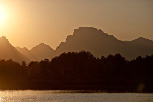 sunset at oxbow bend on the snake river in grand teton national park