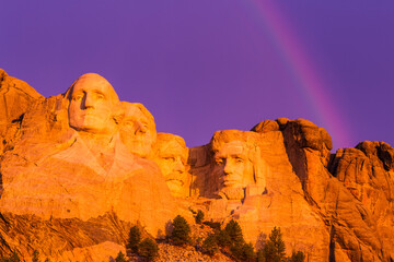 A rainbow stretches above the presidents on Mount Rushmore, South Dakota.