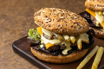 Delicious burgers with asparagus, cheese, tomato and salad