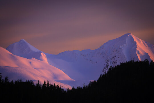 The sun sets over the Southern Chugach Range near Cordova Alaska
