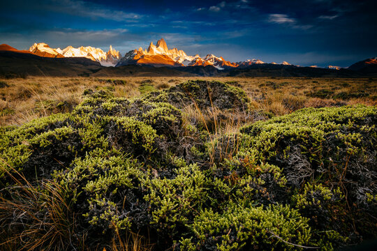 First light hits Cerro Torre and Mount Fitz Roy in Los Glacieres National Park, Argentina.