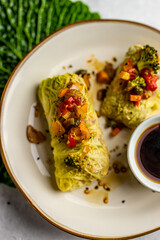 Leaves of Savoy cabbage stuffed with vegetables. Asian cabbage rolls. Vegan. Top view.