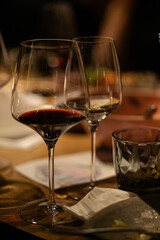 a glass of red wine on the table