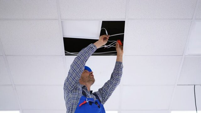 Electrician Installing LED Ceiling Light