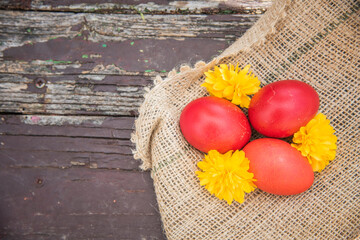Easter eggs on wooden background.  Easter decorations with colored eggs
