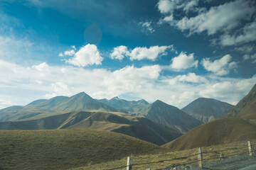 Panorama overlooking the mountains in the clouds. Landscape of the Caucasus Mountains. Fall. Day Georgia.