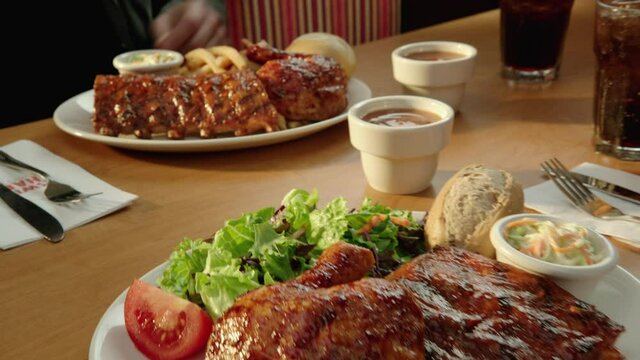 Chicken and Ribs Combo Dinner Plate with Salad and Coleslaw 