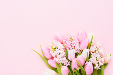 Tulips and pink hyacinths flowers bouquet on pink background. Mothers Day, Valentines Day, Birthday celebration concept