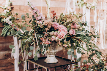 Wedding arrangement of natural flowers in boho style.
