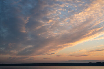 Naklejka na ściany i meble Beautiful sky at sunset and a thin line of the horizon. Creative vintage background.
