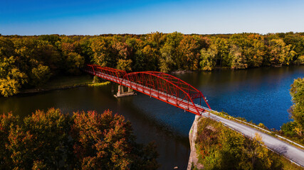 Fototapeta na wymiar Aerial of Renovated Bonta Bridge Road Parker through truss bridge - Erie Canal - Autumn Scenery in New York