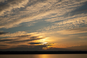 Obraz premium Beautiful sky at sunset and a thin line of the horizon. Creative vintage background.