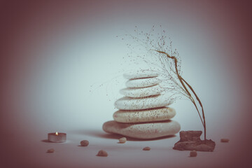 Spa still life with stacked of stone with a beautiful branch