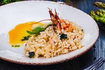 Risotto with seafood on white plate.