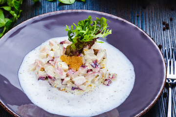 Octopus tartare with pike caviar on a plate