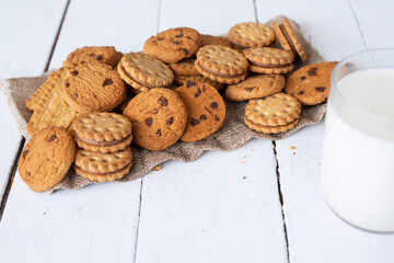 Biscuits with milk on wood background in the morning
