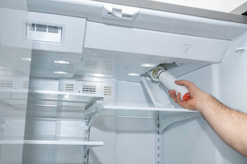 Removing a refrigerator air filter
