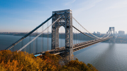 Fototapeta premium Aerial of George Washington Suspension Bridge over Hudson River at Autumn Sunrise - Interstate 95, US Route 1 & 9 - Fort Lee, New Jersey & Bronx, New York City, New York
