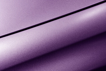 Surface of violet sport sedan car metal hood, part of vehicle bodywork, steel gradient line pattern, automobile industry, selective focus