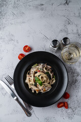 Directly above shot of italian pasta on grey stone background, minimalist shot