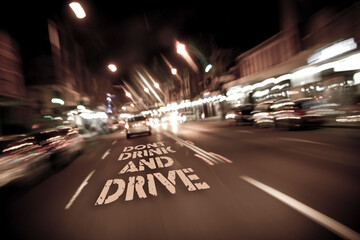 Fototapeta na wymiar City Road at night blurry vision with message don't drink and drive. Go for Plan B
