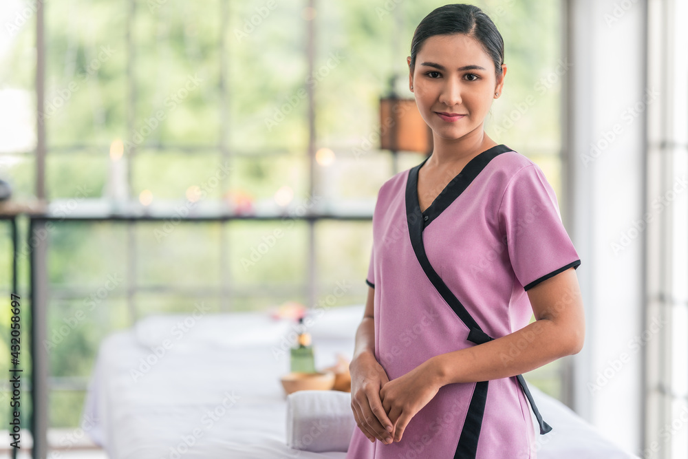 Wall mural beauty woman in uniform as massage therapist of spa salon and massage treatment center