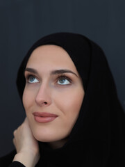 Portrait of modern young muslim woman in black abaya