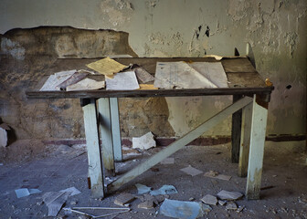 A table in an abandoned building that was one time a coal company's company store before the union was allowed into the mines.