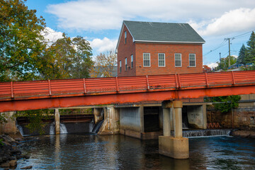 Fototapeta premium Busiel Seeburg Mill on Opechee Bay Reservoir at 1 Mill Plaza in city of Laconia, New Hampshire NH, USA. 