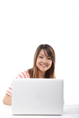 Young Japanese female student operating a personal computer 