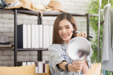 Young woman Live streaming Makeup tutorial