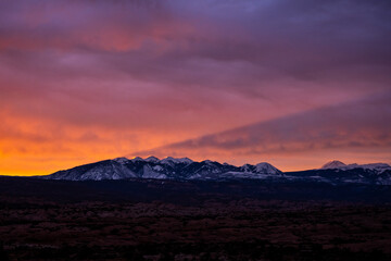 Fototapeta na wymiar La Sal Mountains Cast Shadow In The Sky At Sunrise