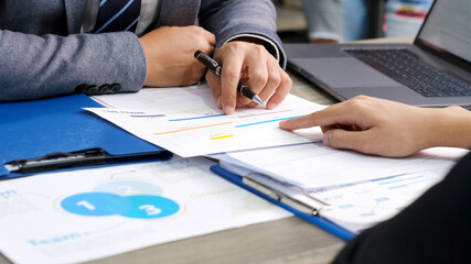   Close up of businessman hands discussing about business plan, Business team analyze business data at office