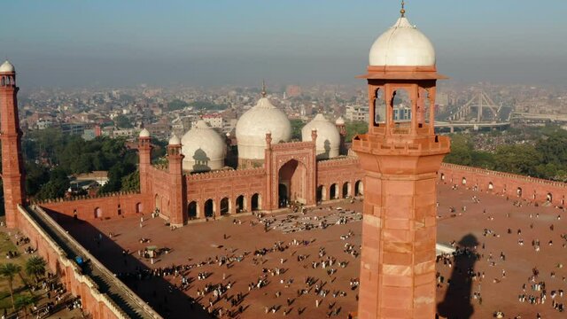 People On Vast Courtyard Of Badshahi Mosque In Lahore Fort, Lahore, Punjab Province, Pakistan. - Aerial Drone Shot