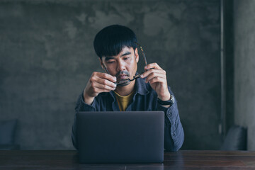 sad depression serious people from work,study stress problem.asian man feeling tired suffering using computer working work place.concept global economic,health problems