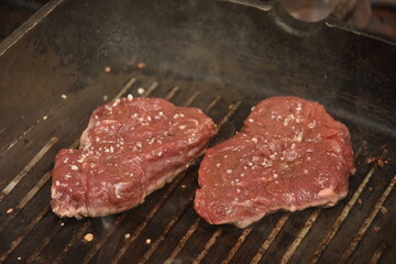 Raw meat on the grill