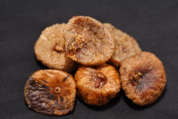 Dried figs isolated on a black  background