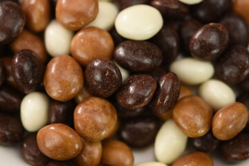  Dark ,white,brown dragee in chocolate cover. 