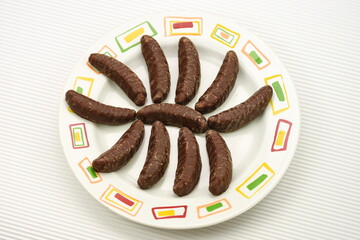 chocolate bananas  on a porcelain plate