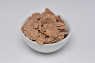 Breakfast Cereal , cocoa cornflakes  in a white  bowl