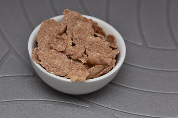 Breakfast Cereal , cocoa cornflakes  in a white  bowl
