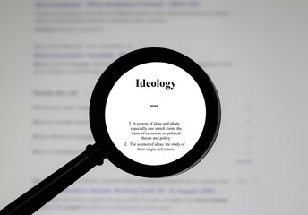 Selective focus on word ideology, word in a dictionary. Close up of an English dictionary page with the word ideology