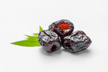 Candied jujube, sweet chinese red date fruit on white background.