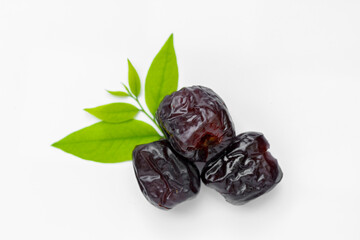 Candied jujube, sweet chinese red date fruit on white background.