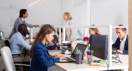 Male and female in office. Working process in open space modern office