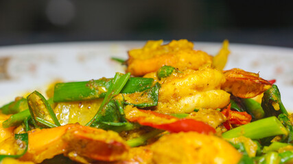 Fried shrimp with curry powder on natural background
